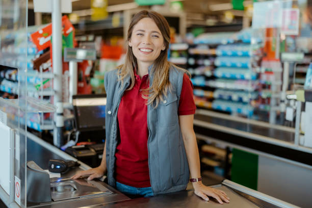 istock Female Cashier Looking at Camera 1432353086
