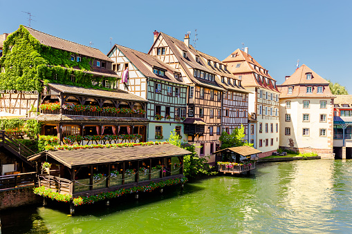 View of beautiful half-timbered houses along the canal seen from Strasbourg France