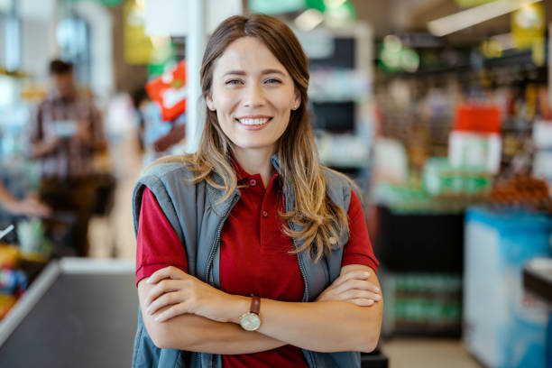 istock Female Cashier Looking at Camera 1432353343