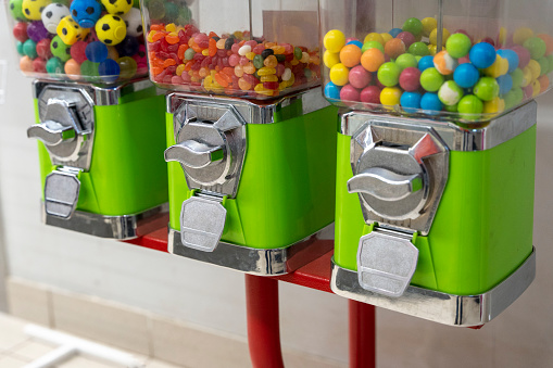 a device for selling sweets and chewing gum installed near the store. vending machine for chewing gum. Children's entertainment