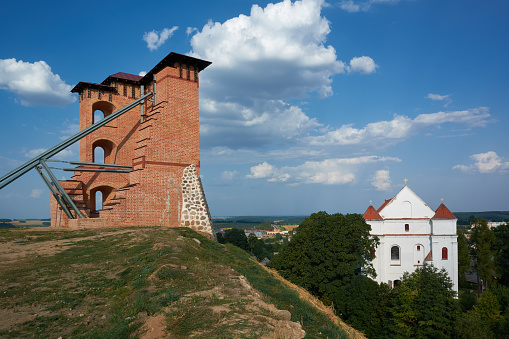 Ruins of Tower and Mindovg Castle on hill, Farnese Church of Transfiguration of the Lord in Novogrudok city, Grodno region, Belarus.