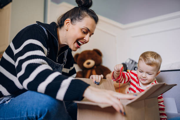 istock Mom helps her son with his Halloween costume 1432363213