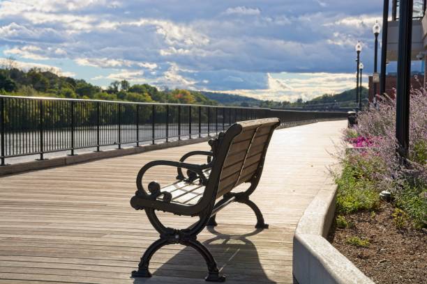 istock Park bench on boardwalk overlooking Merrimack river in Haverhill Massachusetts 1432363257