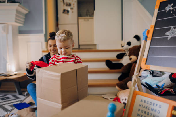 istock Mom helps her son with his Halloween costume 1432363457