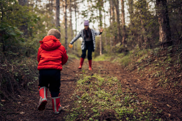 istock Mom and son in the forest 1432366447