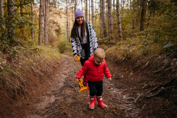 istock Happy mother and son talking while enjoying in autumn day 1432367219