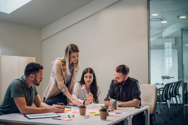 istock Group of colleagues talking about projects during a meeting in a boardroom 1432371131