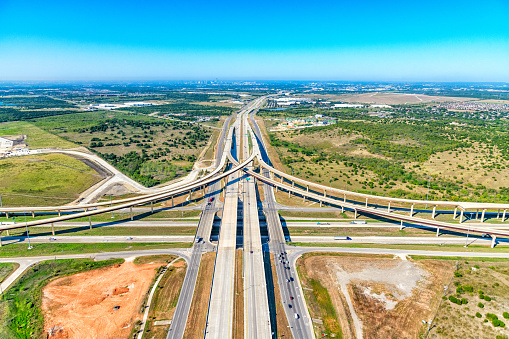 Aerial view of a Texas freeway interchange in the Austin metropolitan area near Pflugerville, Texas.   This image of I-290 and Texas Route 130 interchange was shot from an altitude of about 800 feet.