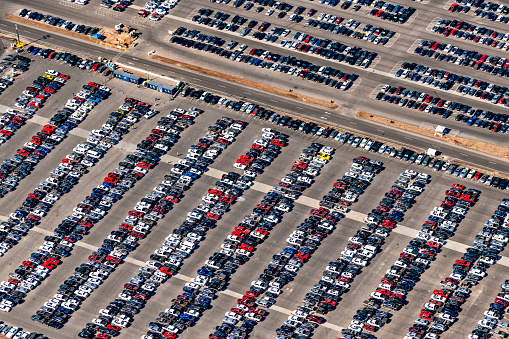 Aerial view of a crowded parking lot at a manufacturing plant in Austin Texas.