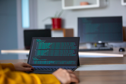 Desktop Programmier Female Programmer Coding On A Desktop Computer And Laptop Stock Photo ...