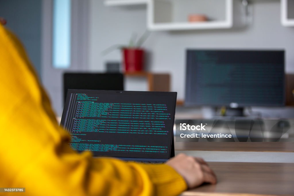 Female Programmer Coding On A Desktop Computer And Laptop Stock Photo ...