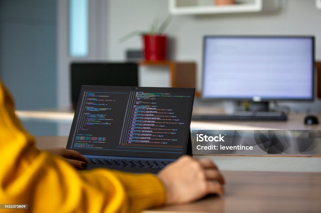 Female Programmer Coding On A Desktop Computer And Laptop Stock Photo ...