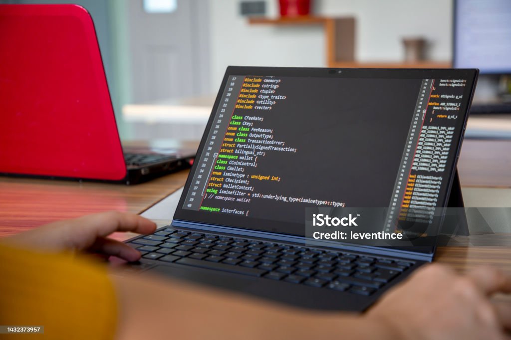 Female Programmer Coding On A Desktop Computer And Laptop Stock Photo ...