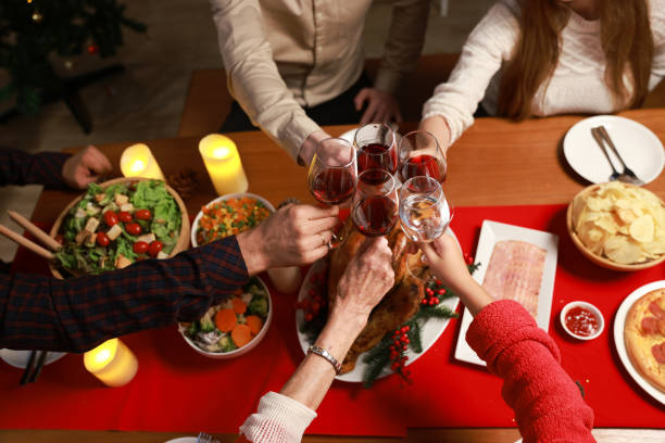 istock Family toasting on Christmas dinner at home 1432374717