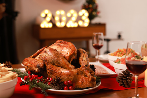 Huge delicious bake chicken  serve on dining table to celebrate  Christmas 's eve or new year