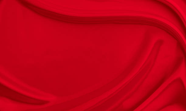 istock Black red satin dark fabric texture luxurious shiny that is abstract silk cloth background with patterns soft waves blur beautiful. 1432381078