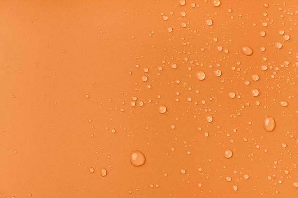 istock Water drops on a brown background with copy space. Macro photography. 1432382043