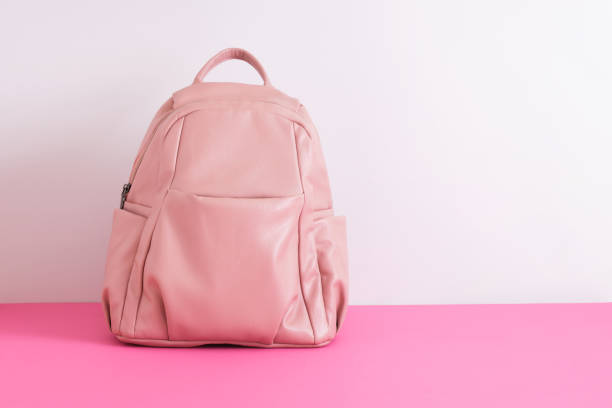istock leather pink backpack on the shoulders on a gray background 1432383110