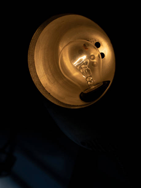 istock Table lamp in dark. Incandescent lamp in interior. 1432383536
