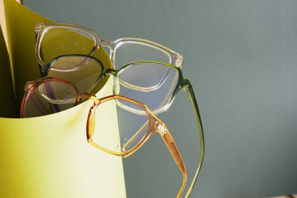 istock glasses on rolled paper, geometric background, green colors 1432383574