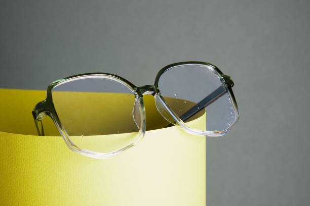 istock glasses on rolled paper, geometric background, green colors 1432383582