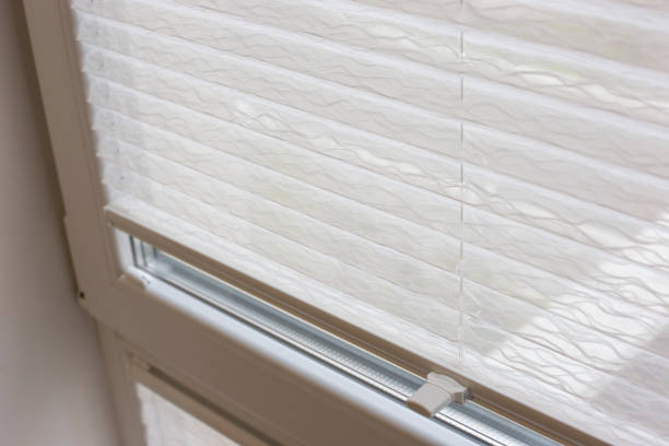 istock Pleated blinds close up on the window in the interior 1432385076