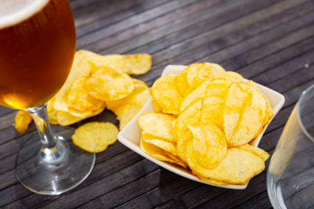 istock Potato chips served with glass of beer 1432385961