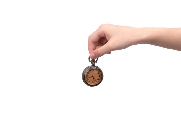 istock One hand held a pocket watch against a white background 1432392639