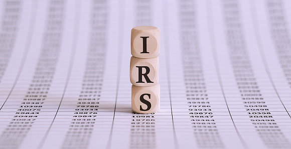 IRS word on a wooden cubes on chart background