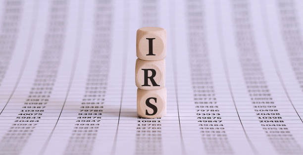 IRS word on a wooden cubes on the chart background stock photo