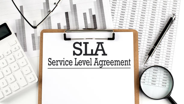 istock Paper with SLA - Service Level Agreement a table on charts, business concept 1432392948