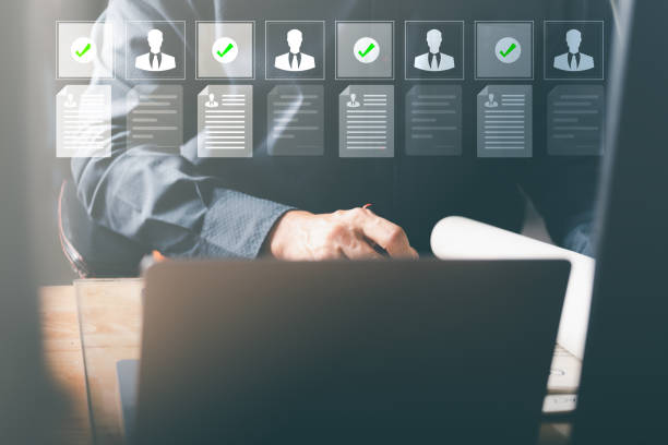 istock Businessman using laptop manage human resource recruiting documents,Concept recruiting business professionals,record keeping database technology file access document sharing 1432394536