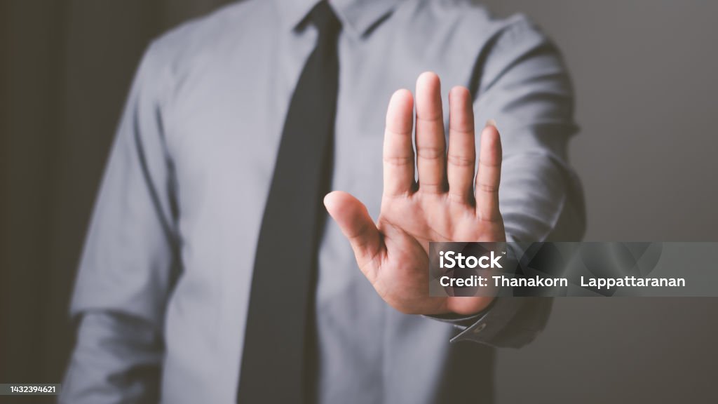 man hand stop sign, warning concept, refusal, caution, symbolic communication, preventing subsequent problems Defending - Sport Stock Photo