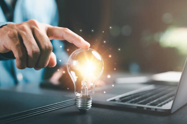 istock Businessman's hand touching on a light bulb, innovative and inspirational concept,Technology creativity for future inventions and developments,Business for innovative solution concept. 1432394671