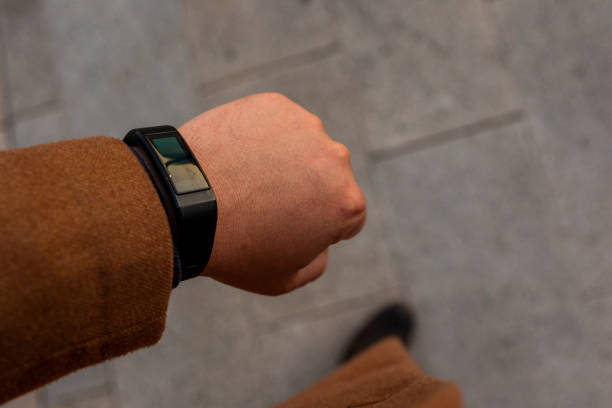 istock Electronic watch on a man's hand. Top view. top view 1432395922