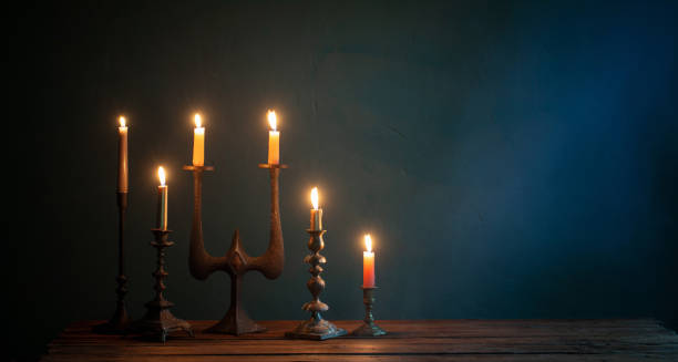 istock burning candles in vintage candlesticks on dark background 1432396293