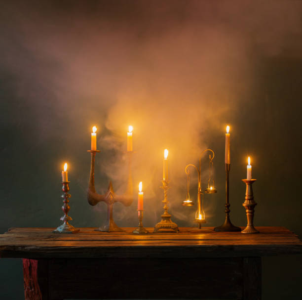 istock burning candles in vintage candlesticks on dark background 1432396297
