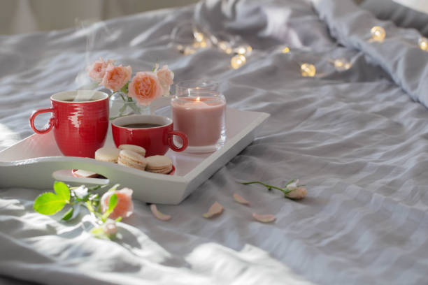 istock two red cups of coffee and flowers on bed 1432396319