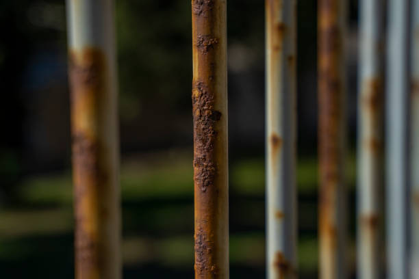 istock Close-up of orange rust on a white metal railing. Rust from water ingress. Rusty steel structure loses its properties from time to time 1432398084