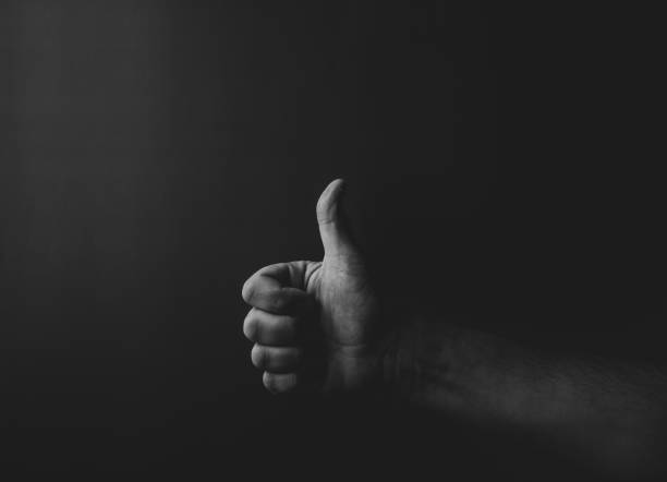istock man's hand showing thumbs up 1432398116