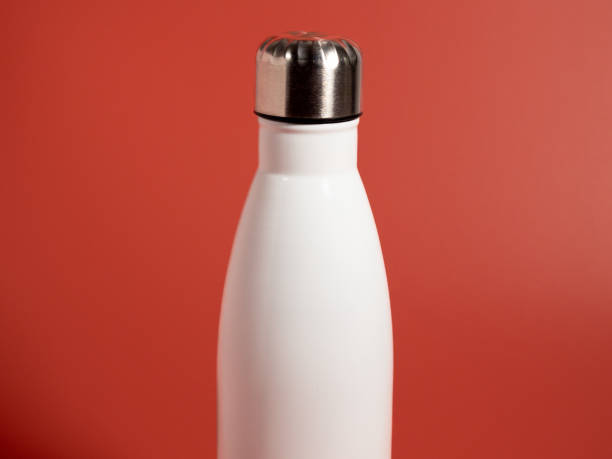 istock White Thermal bottle on a pink background. Thermos bottle 1432398221