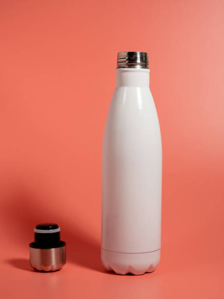 istock White Thermal bottle on a pink background. Thermos bottle 1432398222