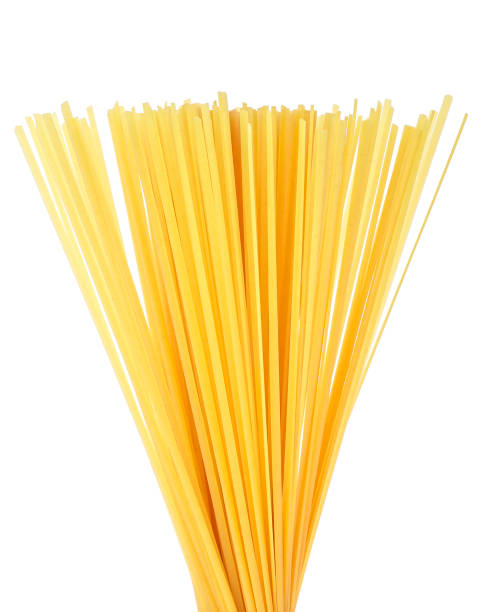 istock Raw spaghetti isolated on a white background. Uncooked pasta. 1432398900