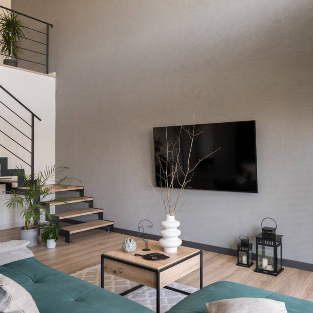 istock Big tv on concrete wall in living room 1432403634