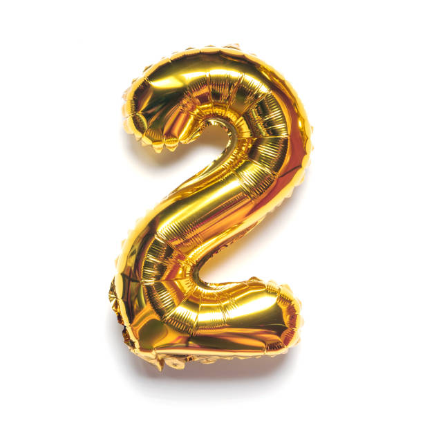 istock Foil gold balloon number 2 two on white background. 1432406333