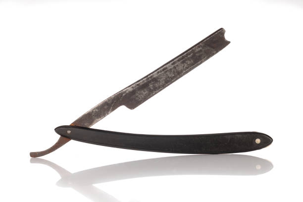 istock Antique shaving razor on white background, old and worn out. 1432406424