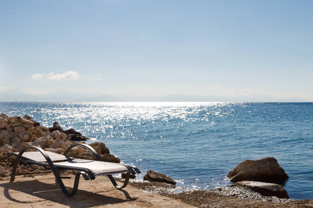 Chair on the beach near the sea. Summer vacation and vacation concept for tourism. Inspiring tropical landscape. Blue water, copy-space