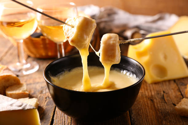 istock cheese fondue with wine glasses and bread 1432407043