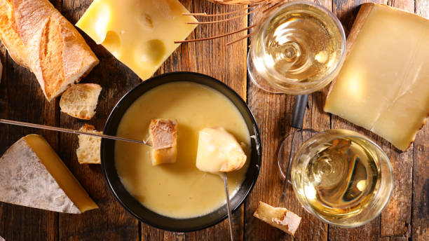 istock cheese fondue with wine glasses and bread 1432407046