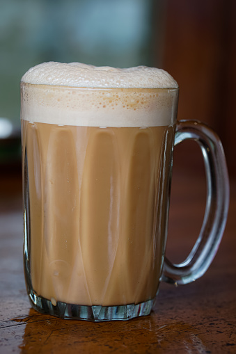 Popular drink in Malaysia called Teh Tarik. It is a sweet drink made from tea with milk.